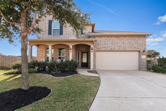 view of front of house with a front yard, a porch, and a garage