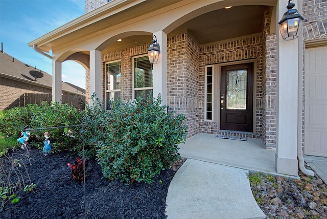 entrance to property featuring covered porch