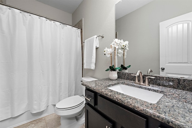 full bathroom featuring tile patterned flooring, vanity, toilet, and shower / bath combo