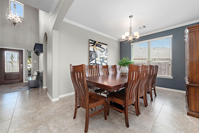 dining area featuring a chandelier, ornamental molding, and light tile patterned flooring