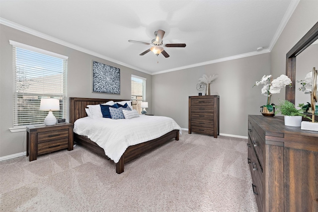 bedroom with ceiling fan, light colored carpet, and crown molding