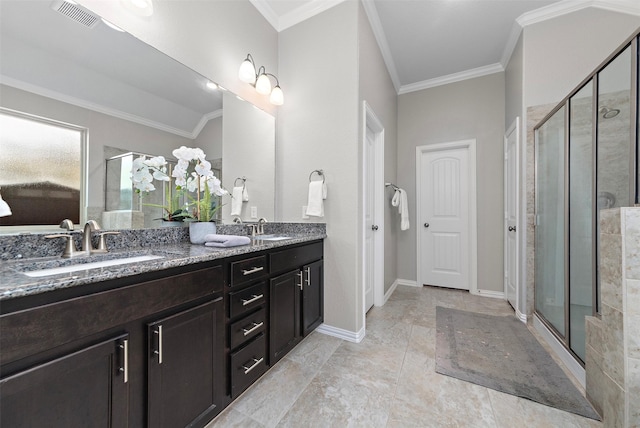 bathroom featuring vanity, ornamental molding, and walk in shower