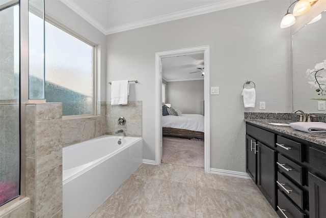 bathroom featuring vanity, a tub, ceiling fan, and crown molding