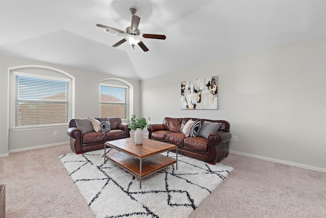 living room with ceiling fan, light colored carpet, a healthy amount of sunlight, and vaulted ceiling