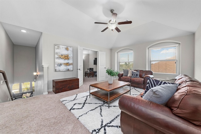 living room with carpet floors, vaulted ceiling, and ceiling fan