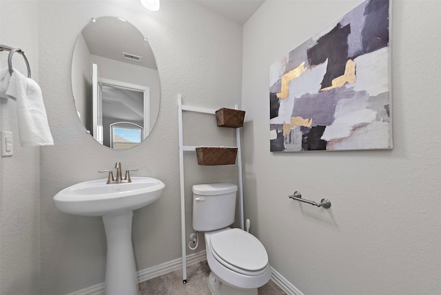 bathroom with toilet and sink