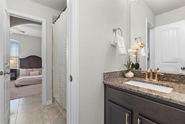 bathroom featuring tile patterned flooring and vanity