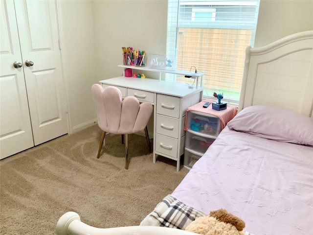 carpeted bedroom with a closet