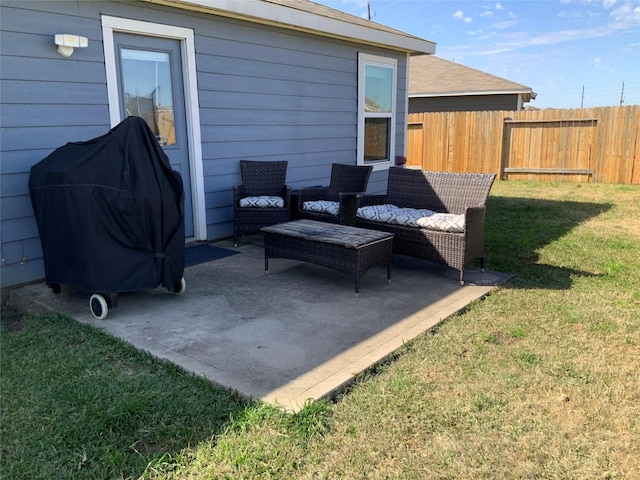 view of patio featuring a grill