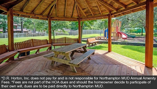 wooden terrace featuring a gazebo, a playground, and a yard