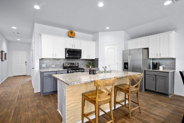 kitchen with white cabinets, appliances with stainless steel finishes, and gray cabinetry