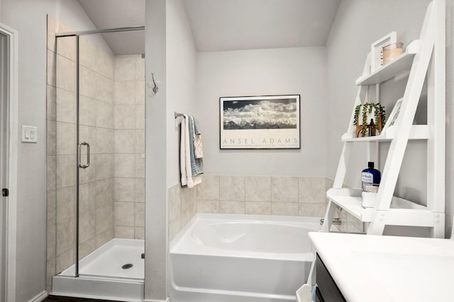 bathroom featuring vanity and plus walk in shower