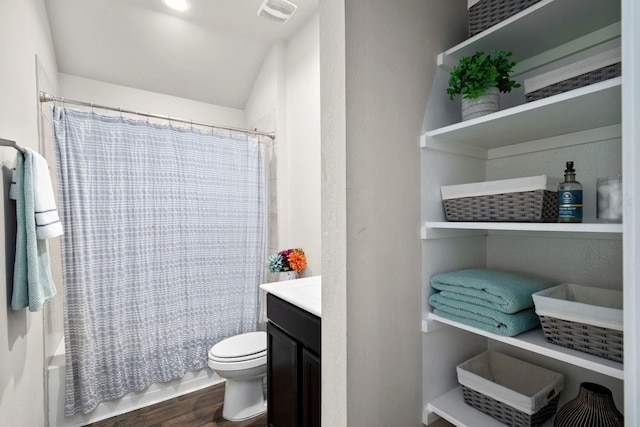 full bathroom featuring vanity, shower / bath combination with curtain, toilet, and wood-type flooring