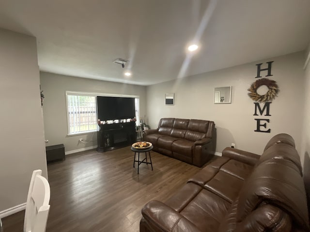 living room featuring dark hardwood / wood-style floors