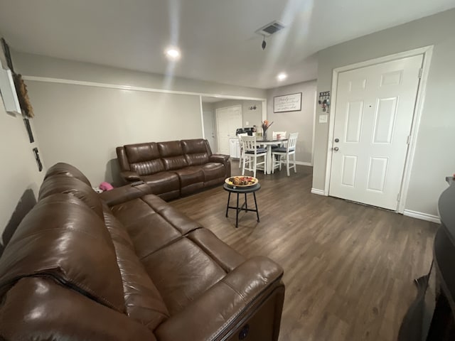 living room with dark hardwood / wood-style floors