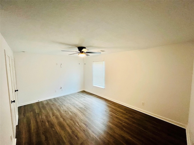 unfurnished room featuring a textured ceiling, ceiling fan, and dark wood-type flooring