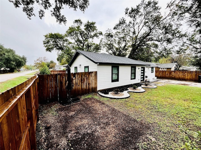 view of property exterior featuring a lawn