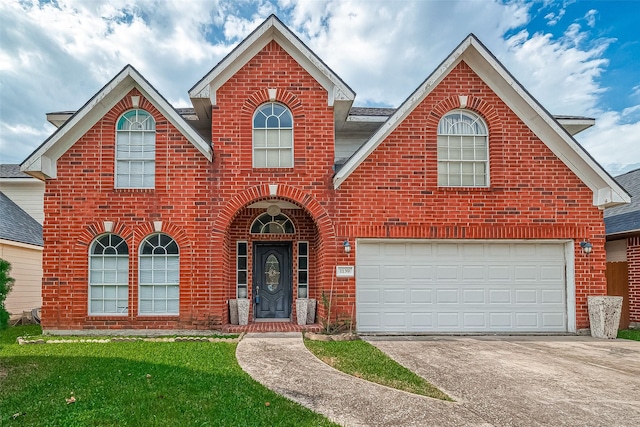 front facade featuring a front yard and a garage