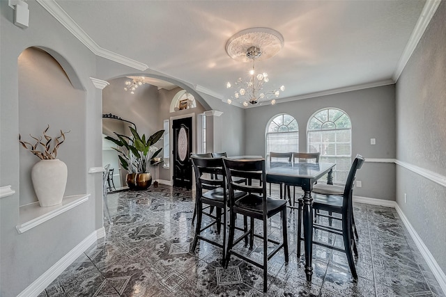 dining room featuring crown molding and a notable chandelier