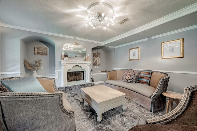 living room featuring ornamental molding, a textured ceiling, and a high end fireplace