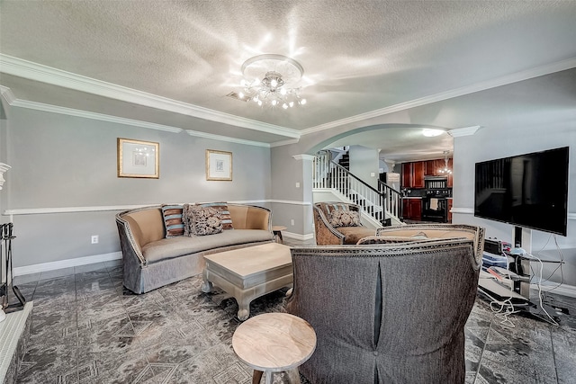 living room with a textured ceiling, crown molding, and an inviting chandelier