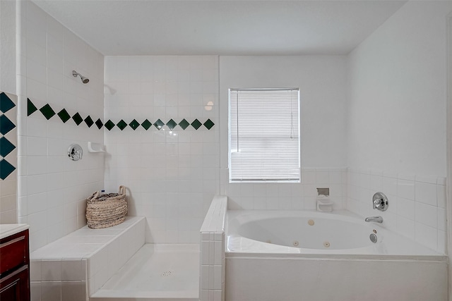 bathroom featuring shower with separate bathtub and vanity