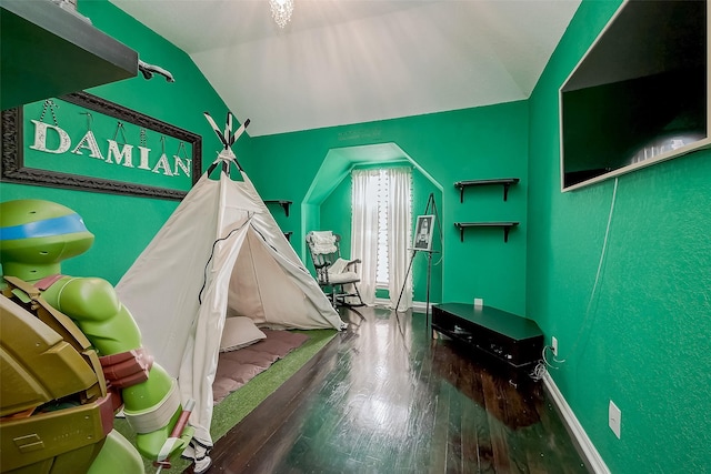 game room with wood-type flooring and vaulted ceiling