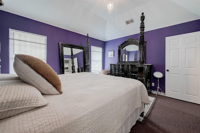 bedroom with lofted ceiling and carpet floors