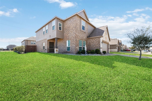 view of side of home with a garage and a lawn