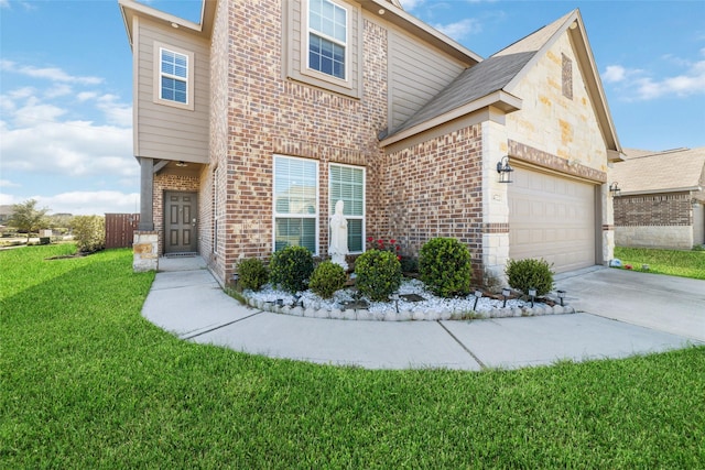 view of front of property featuring a front yard and a garage