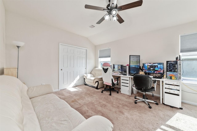 office featuring light carpet, ceiling fan, and vaulted ceiling