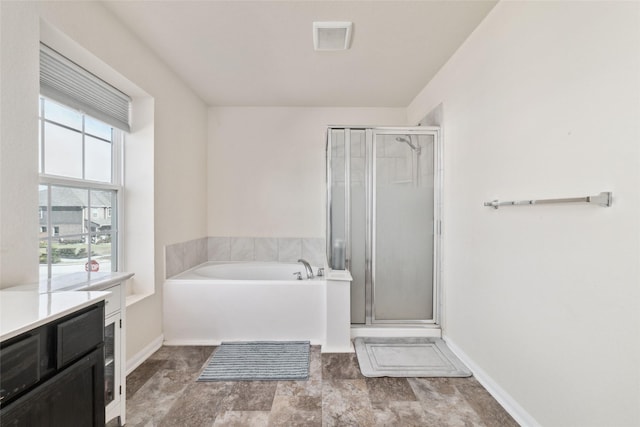 bathroom with shower with separate bathtub and vanity