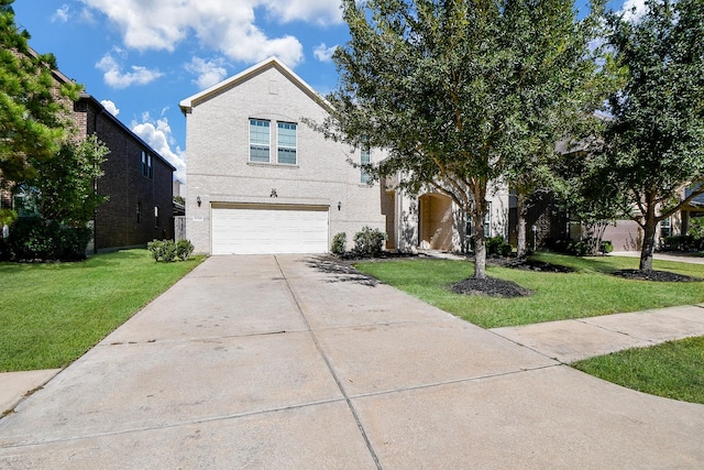 view of front of home with a front lawn and a garage