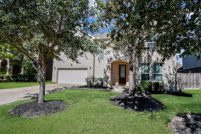 view of front of house with a front lawn and a garage