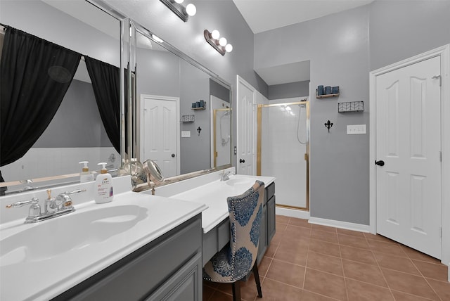 bathroom featuring vanity, walk in shower, and tile patterned floors