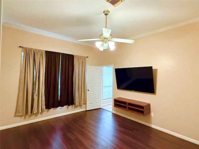 unfurnished living room featuring ceiling fan, dark wood-type flooring, and ornamental molding