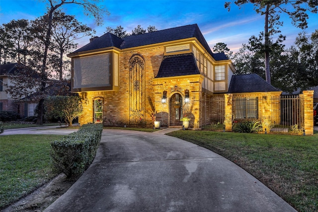 view of front of house with a lawn