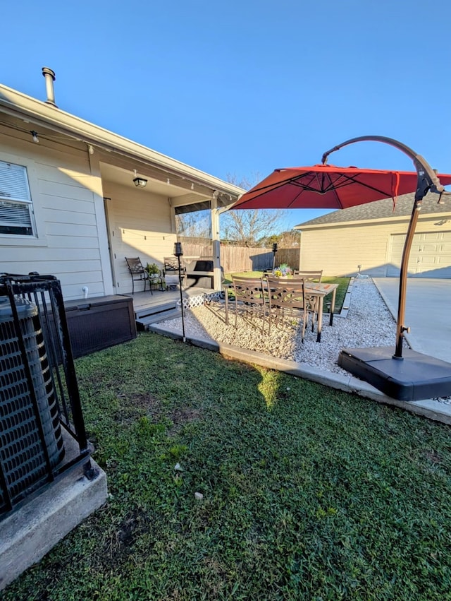 view of yard featuring cooling unit and a patio area