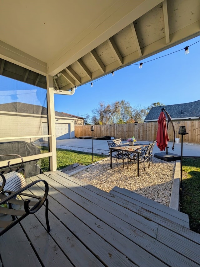 wooden terrace featuring a patio area