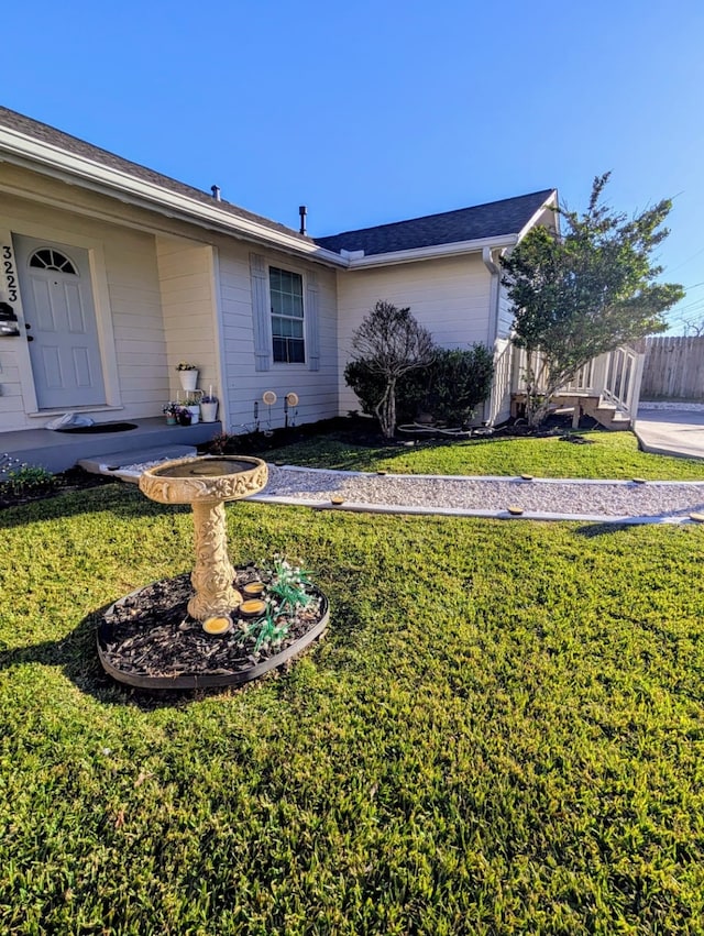 view of side of property with a yard