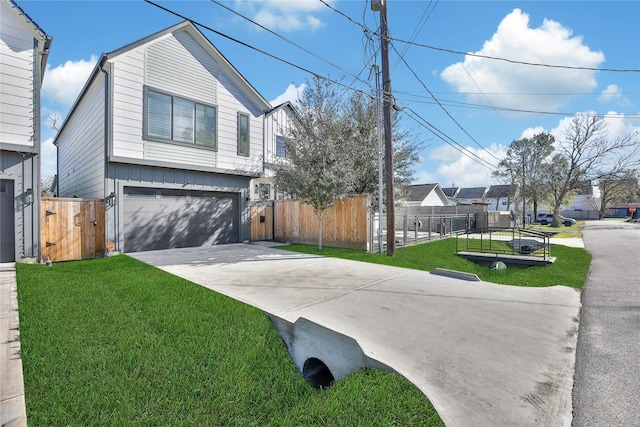 view of front of home with a garage and a front yard