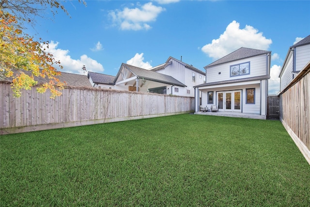 rear view of house with a yard