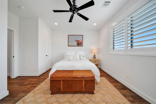 bedroom featuring ceiling fan and dark hardwood / wood-style floors