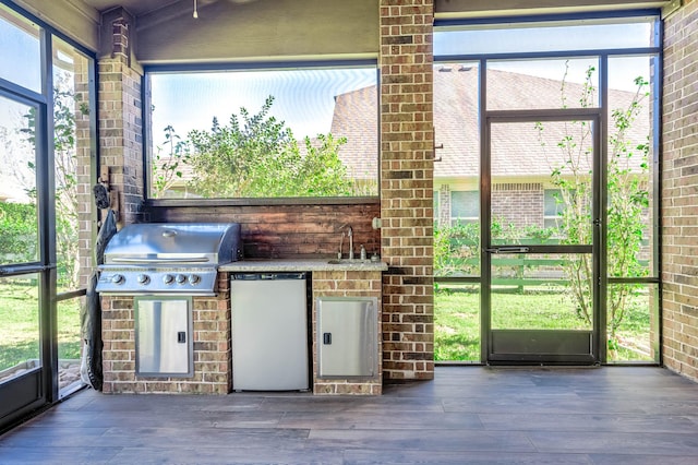 unfurnished sunroom featuring sink