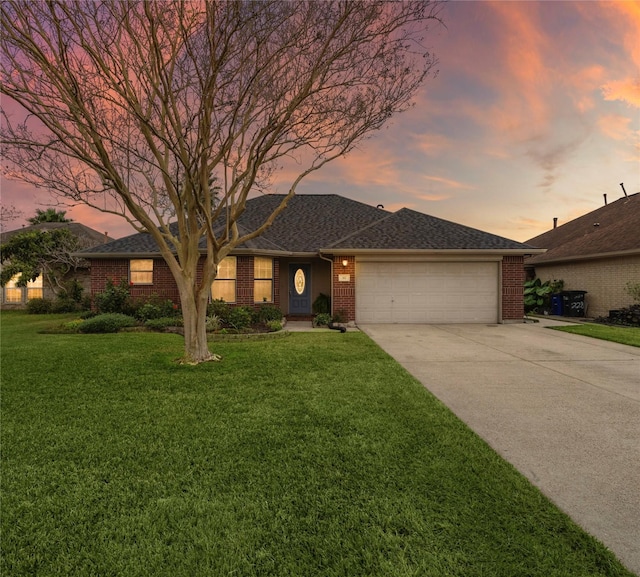 single story home with a yard and a garage