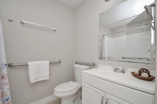 bathroom with toilet, tile patterned flooring, walk in shower, and vanity