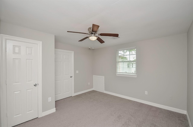 unfurnished bedroom with light carpet and ceiling fan