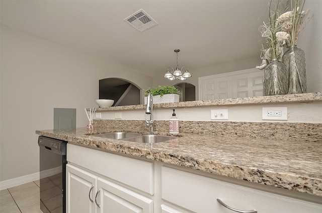 kitchen with sink, black dishwasher, white cabinetry, an inviting chandelier, and light tile patterned flooring