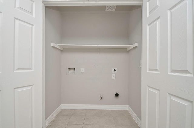 laundry room with gas dryer hookup, hookup for an electric dryer, hookup for a washing machine, and light tile patterned flooring