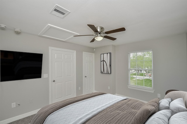 bedroom featuring ceiling fan and carpet